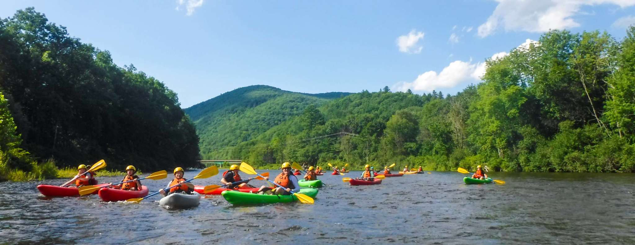 family in kayaks on the deerfield river