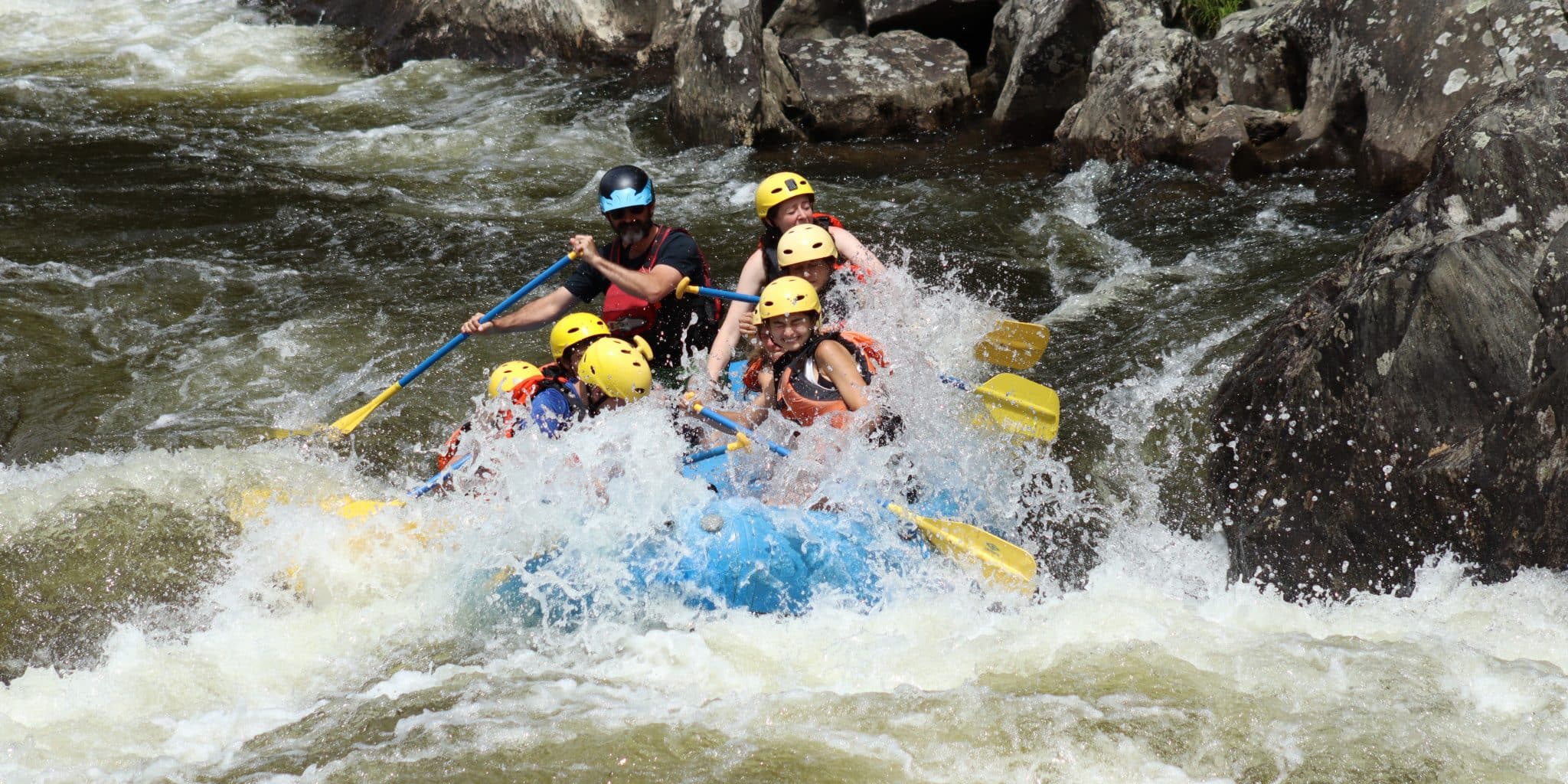 Group of paddlers on whitewater adventure down Deerfield river