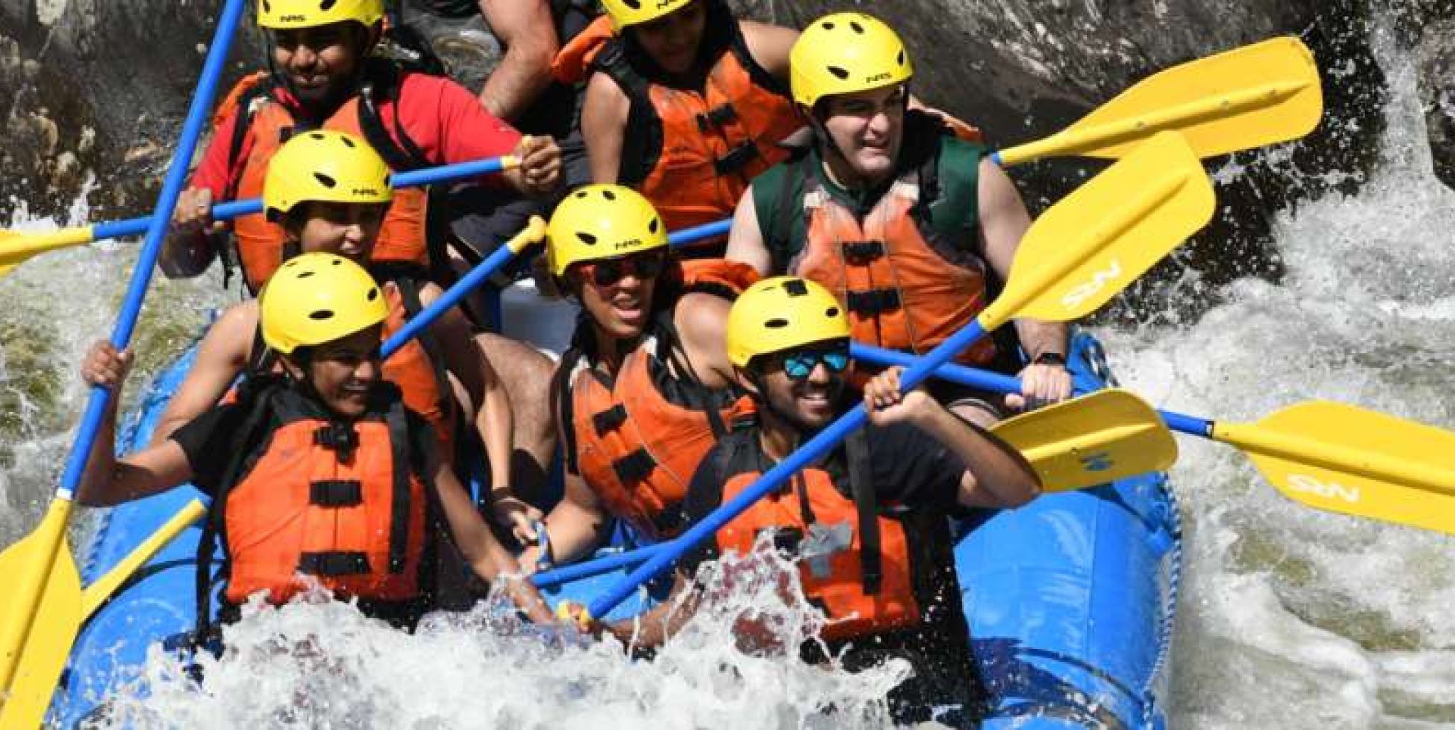 Group of rafters on whitewater adventure down Deerfield river